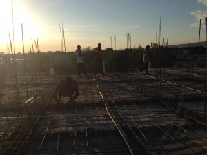 Haitians working on the roof in Onaville Haiti 